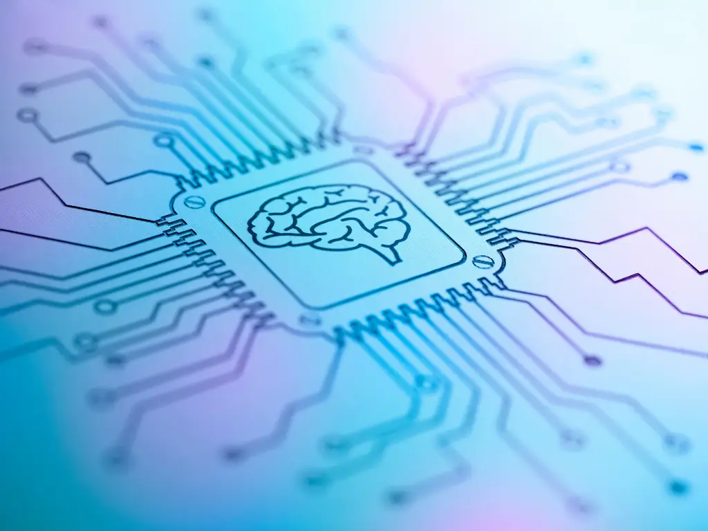 Puce électronique illustrée d’un cerveau, reliée à des pistes de circuit